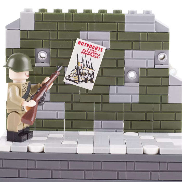 Soviet Soldier observes a  Propaganda poster 